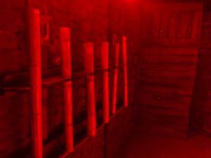 A view inside an escape room with red lighting