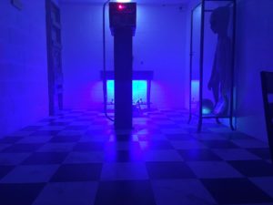 A view inside an escape room with blue lighting